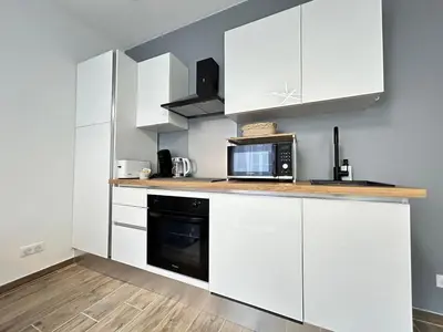Cuisine ou kitchenette dans l'établissement Chamonix magnifique duplex avec terrasse au centre