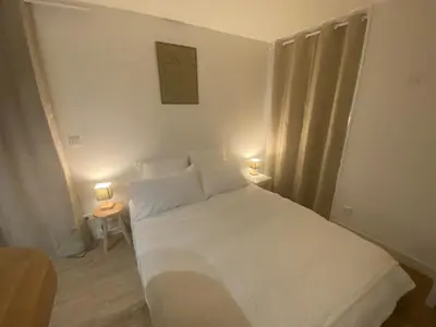 Un ou plusieurs lits dans un hébergement de l'établissement Le Nid'Ophé Studio Cosy - Proche Disneyland Paris