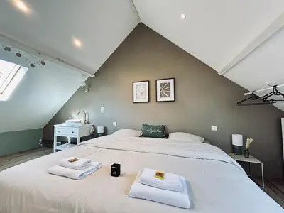 Un ou plusieurs lits dans un hébergement de l'établissement Marzilly maison cosy 3 chbrs avec suite parentale