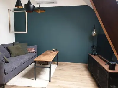 Coin salon dans l'établissement Appartement La Buissonnière