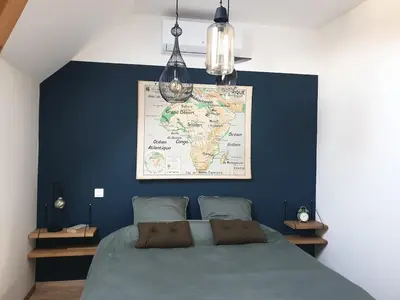 Un ou plusieurs lits dans un hébergement de l'établissement Appartement La Buissonnière