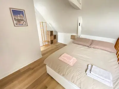 Un ou plusieurs lits dans un hébergement de l'établissement Jolie maison Margnotine avec cour & parking privés