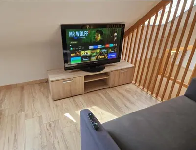 Télévision ou salle de divertissement dans l'établissement Appartement Plein Centre