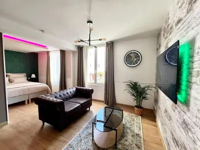 Un ou plusieurs lits dans un hébergement de l'établissement L'Etoile-Appartement élégant au coeur d'Epernay, proche de l' avenue de Champagne
