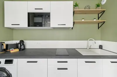 Cuisine ou kitchenette dans l'établissement le SPARN - Votre cocon au coeur d'Epernay