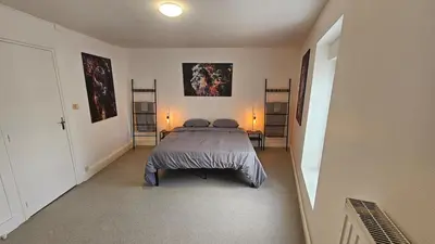 Un ou plusieurs lits dans un hébergement de l'établissement La Tanière Sedanaise 2 bedrooms parking wifi