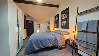 Un ou plusieurs lits dans un hébergement de l'établissement La Tanière Sedanaise 2 bedrooms parking wifi