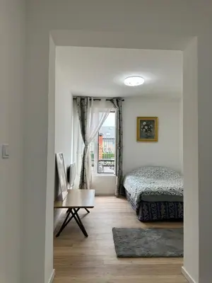 Un ou plusieurs lits dans un hébergement de l'établissement La maison du 4