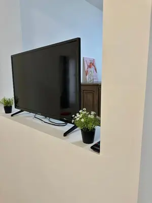 Télévision ou salle de divertissement dans l'établissement La maison du 4