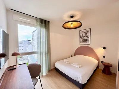 Un ou plusieurs lits dans un hébergement de l'établissement We Live Inn Sharies Reims A405