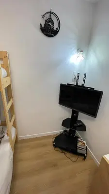 Télévision ou salle de divertissement dans l'établissement Paco Homestay