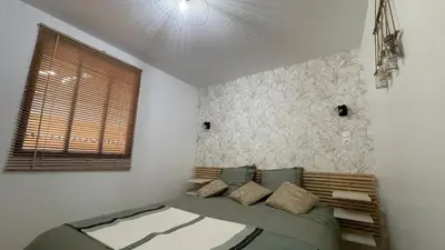 Un ou plusieurs lits dans un hébergement de l'établissement Paco Homestay