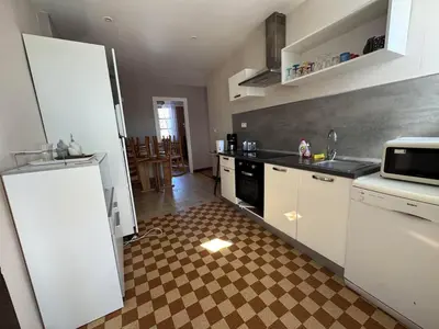 Cuisine ou kitchenette dans l'établissement Le nid d'Hirondelle