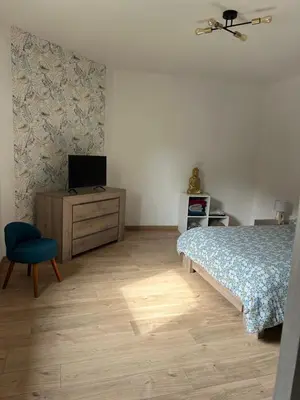 Un ou plusieurs lits dans un hébergement de l'établissement Maison calme à la campagne
