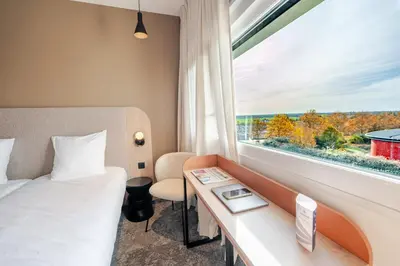 Un ou plusieurs lits dans un hébergement de l'établissement Hôtel AKENA Chalons-en-Champagne