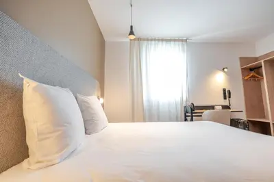 Un ou plusieurs lits dans un hébergement de l'établissement Hôtel AKENA Chalons-en-Champagne