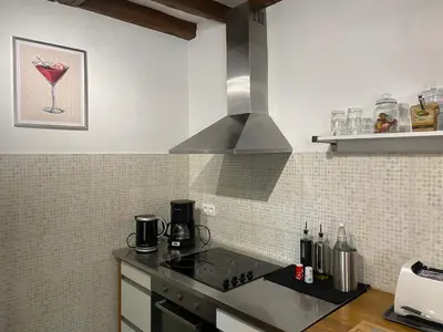 Cuisine ou kitchenette dans l'établissement Maison des Roses
