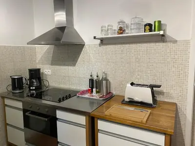 Cuisine ou kitchenette dans l'établissement Maison des Roses