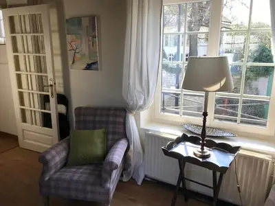 Coin salon dans l'établissement Maison des Roses