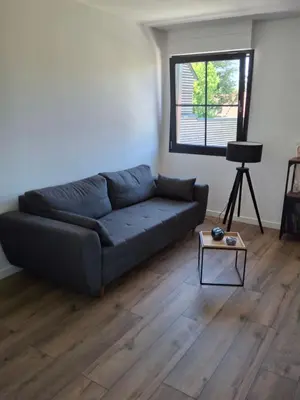 Coin salon dans l'établissement La maison d'à côté Chambre 1