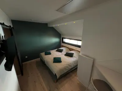 Un ou plusieurs lits dans un hébergement de l'établissement La Maison d'à Côté Chambre 4