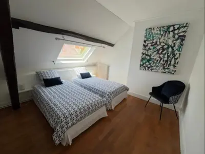 Un ou plusieurs lits dans un hébergement de l'établissement Maison cocooning avec magnifique jardin