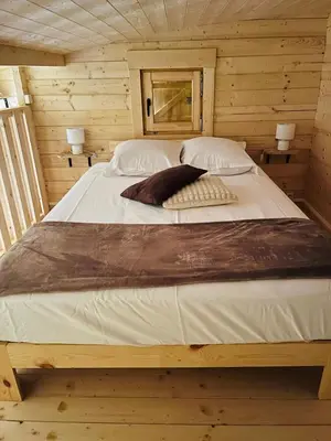Un ou plusieurs lits dans un hébergement de l'établissement Le chalet des Sarteaux
