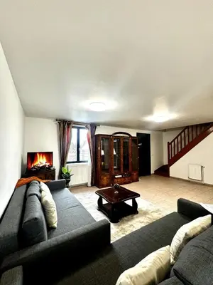 Coin salon dans l'établissement Maison familiale Vintage à Meaux