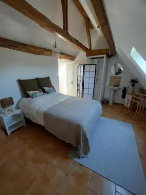 Un ou plusieurs lits dans un hébergement de l'établissement Maison campagne proche Disney au calme