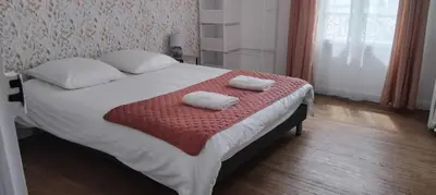 Un ou plusieurs lits dans un hébergement de l'établissement Chez Sparky - Reims centre - 2 chambres au calme