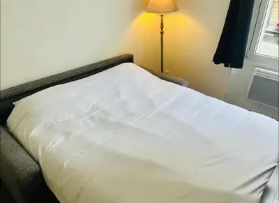 Un ou plusieurs lits dans un hébergement de l'établissement Coquebert studio confortable proche centre ville