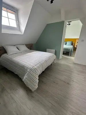 Un ou plusieurs lits dans un hébergement de l'établissement Appartement T3
