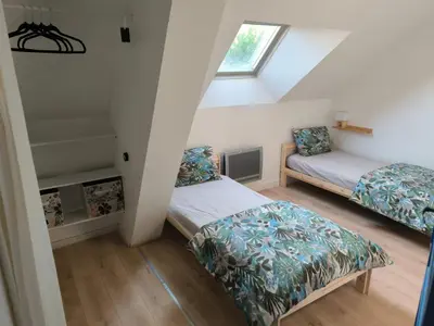 Un ou plusieurs lits dans un hébergement de l'établissement La Maison bleue Paissy