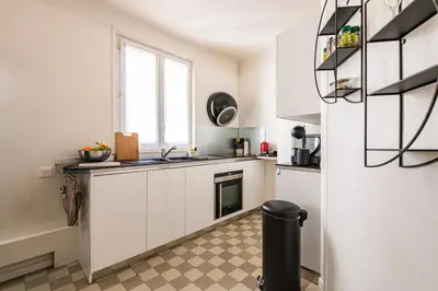 Cuisine ou kitchenette dans l'établissement L'instant Rémois