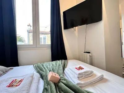 Un ou plusieurs lits dans un hébergement de l'établissement Bali 8 studio cosy proche centre ville
