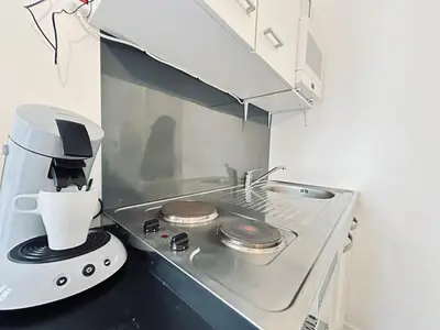 Cuisine ou kitchenette dans l'établissement Lys 7 magnifique studio tout équipé proche de tout