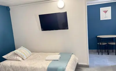 Un ou plusieurs lits dans un hébergement de l'établissement Studio Platanes 8 - Proche Disneyland - Parking gratuit - Meaux