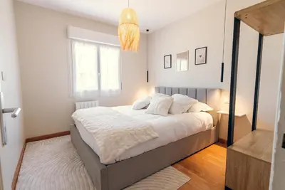 Un ou plusieurs lits dans un hébergement de l'établissement L'élegant, climatisé et rénové - Appart'hôtel Chez MV