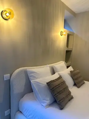 Un ou plusieurs lits dans un hébergement de l'établissement Suite Élan by CollectionAura - Hypercentre Charleville-Mézières
