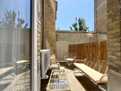Coin salon dans l'établissement Le Noa - 2 Chambres - Climatisation - Terrasse