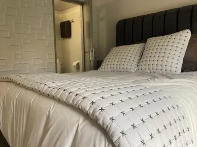 Un ou plusieurs lits dans un hébergement de l'établissement HSH France Chambre City 3 Proche de Disney