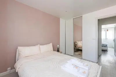 Un ou plusieurs lits dans un hébergement de l'établissement Reims Centre, Appartement 4 Chambres NETFLIX