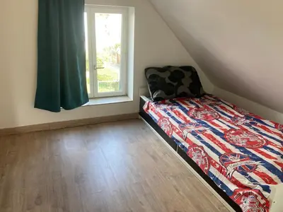 Un ou plusieurs lits dans un hébergement de l'établissement Jolie petite maison de campagne