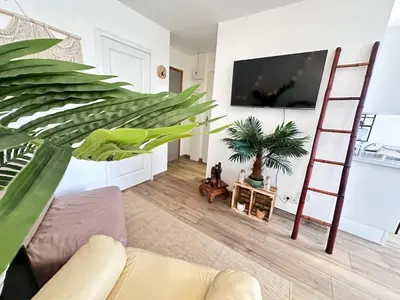 Télévision ou salle de divertissement dans l'établissement La détente de Robinson T2 agréable proche centre