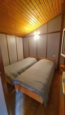 Un ou plusieurs lits dans un hébergement de l'établissement Chalet LE CORPIAS