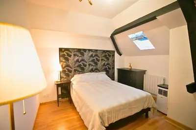 Un ou plusieurs lits dans un hébergement de l'établissement Casa Duplex Hirson