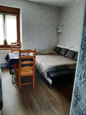 Un ou plusieurs lits dans un hébergement de l'établissement Le studio à la campagne