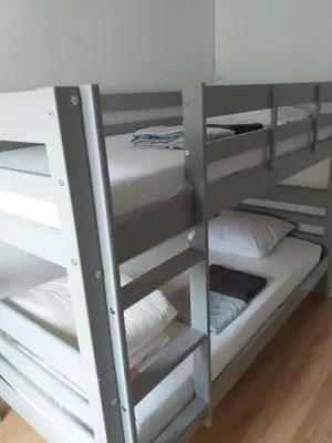 Un ou plusieurs lits dans un hébergement de l'établissement Tres bel appartement face au Chateau 2 ch 4 pers - BAUDELAIRE