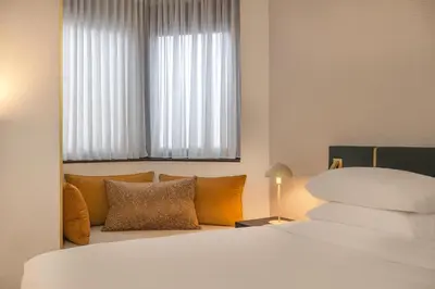 Un ou plusieurs lits dans un hébergement de l'établissement Hyatt Centric Reims