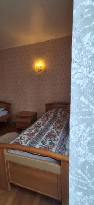 Un ou plusieurs lits dans un hébergement de l'établissement Le Clos Riga